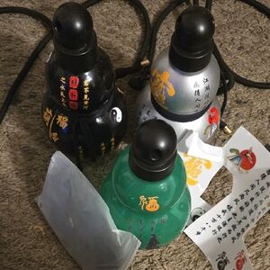 Set of Three Decorative Bottles with Asian Script